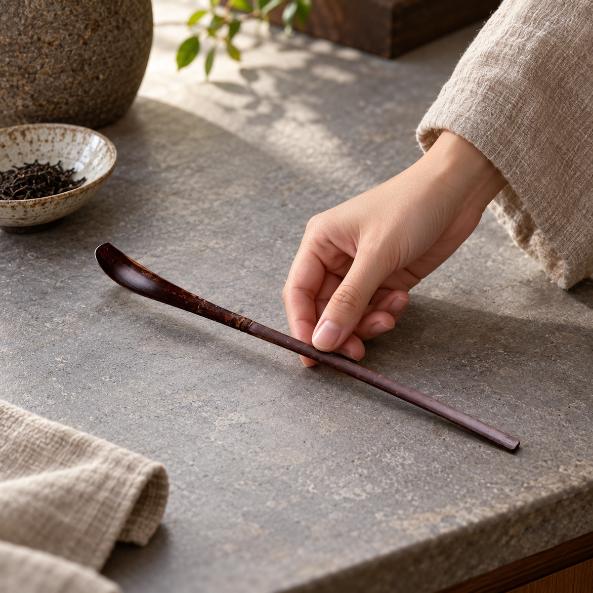 Wooden matcha scoop in a home setting