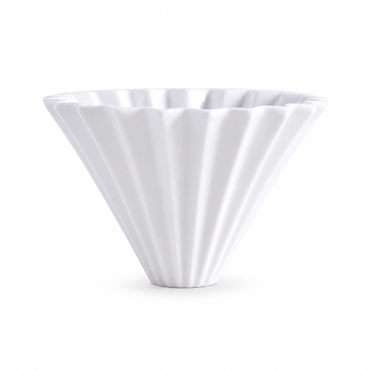 Ceramic pour-over coffee dripper on a white background