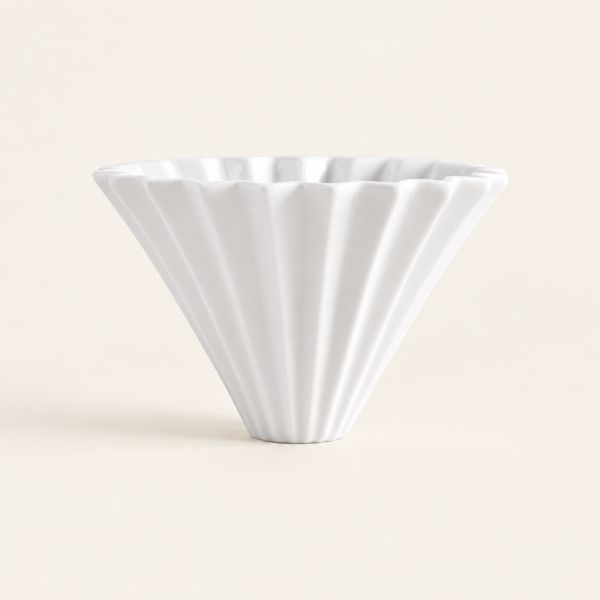 Ceramic pour-over coffee dripper in the cream studio