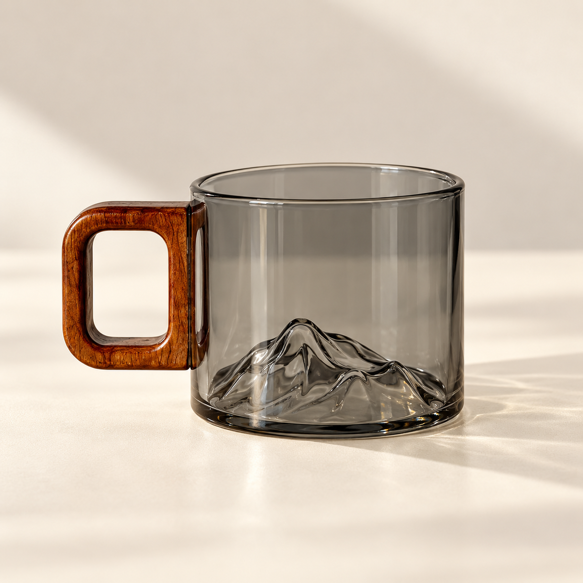 1 matching smoke-grey Ridgeline glass coffee cup on a cream background