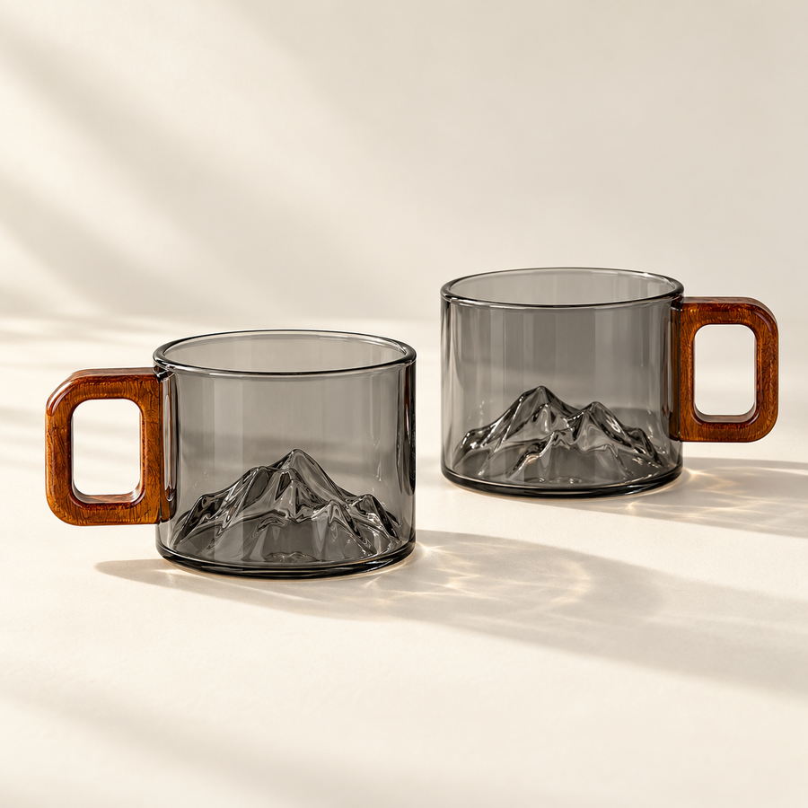 2 matching smoke-grey Ridgeline glass coffee cups on a cream background