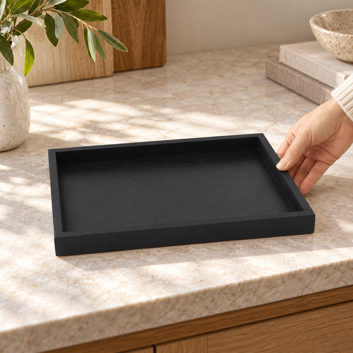 Black wooden serving tray in a home setting